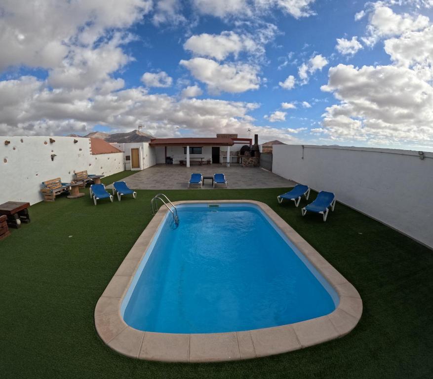 a swimming pool on the roof of a house at Casa Rural Muchichafe in Puerto del Rosario