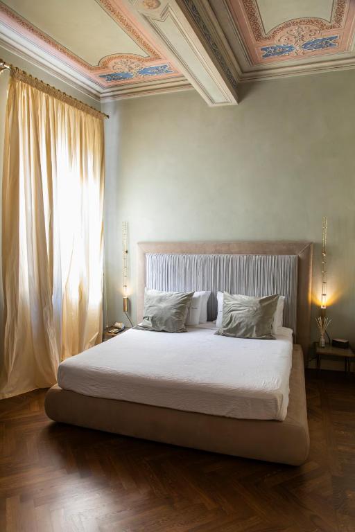 Postel nebo postele na pokoji v ubytování Domus Tua