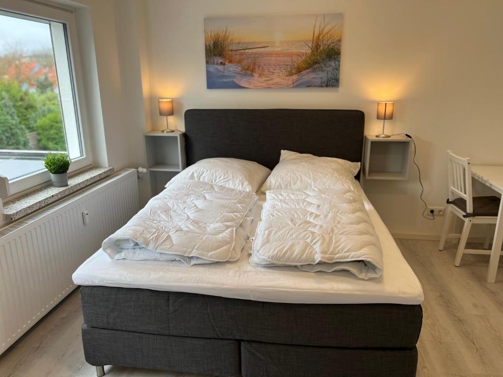 Postel nebo postele na pokoji v ubytování Mimi's Ostseeglück