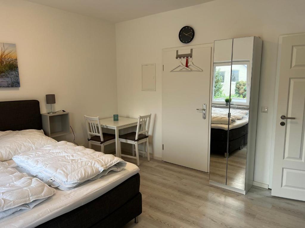Postel nebo postele na pokoji v ubytování Mimi's Ostseeglück