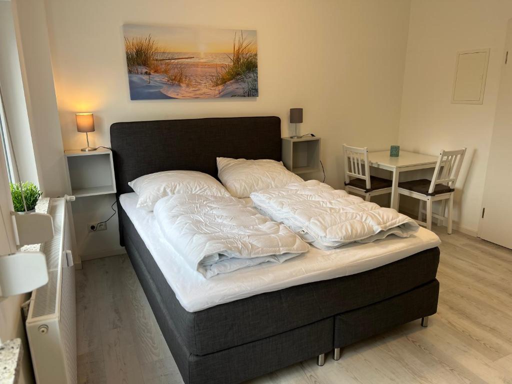 Postel nebo postele na pokoji v ubytování Mimi's Ostseeglück