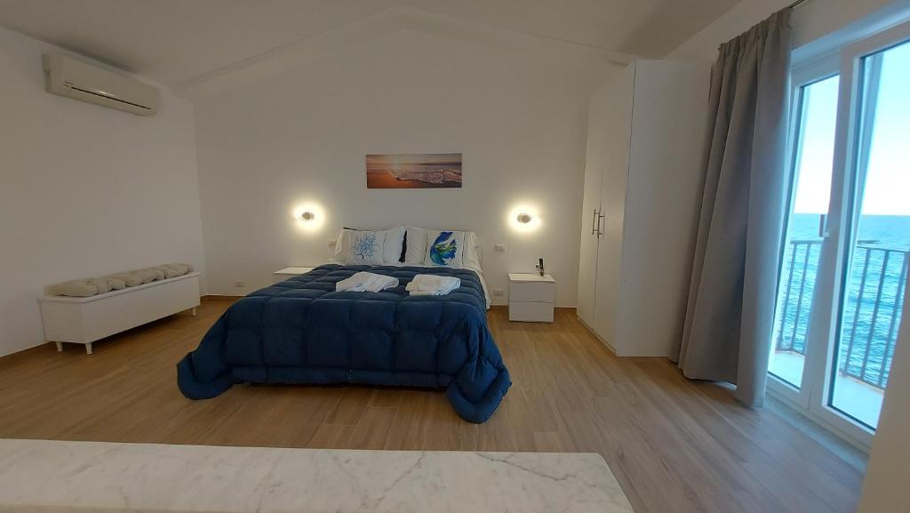 Posteľ alebo postele v izbe v ubytovaní Marina House