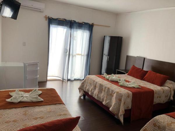 Postel nebo postele na pokoji v ubytování Complejo Laderas del Cerro