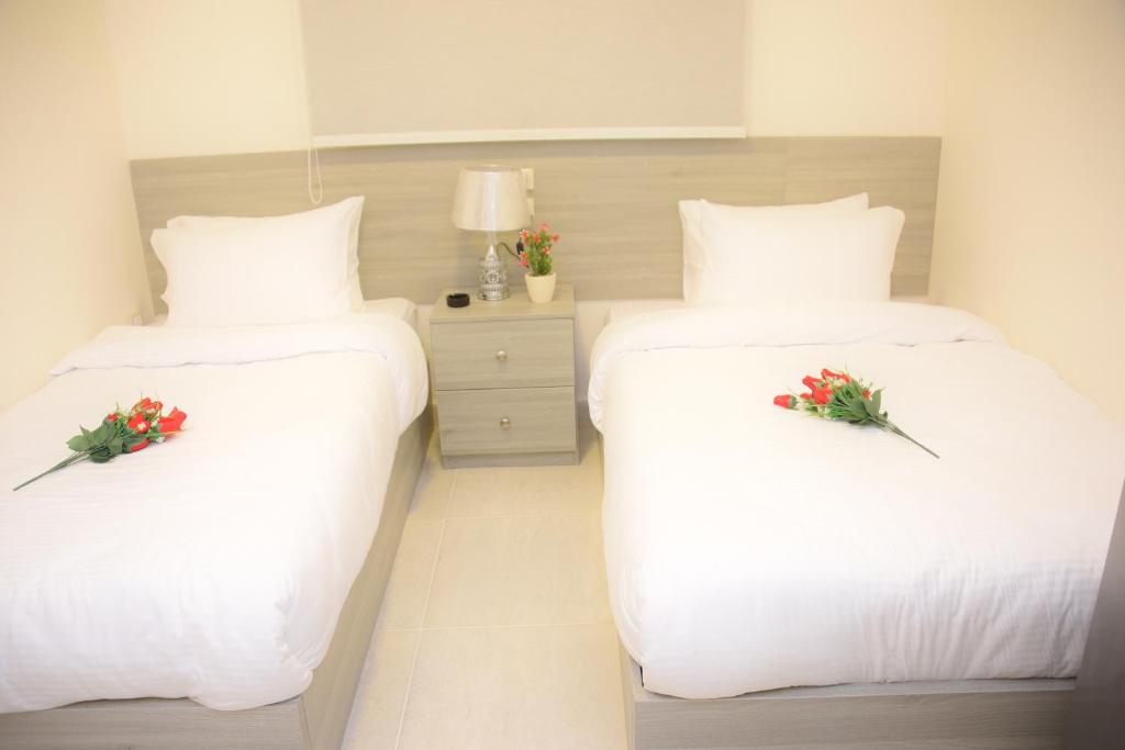 Ein Bett oder Betten in einem Zimmer der Unterkunft Yasmin Pyramids Boutique