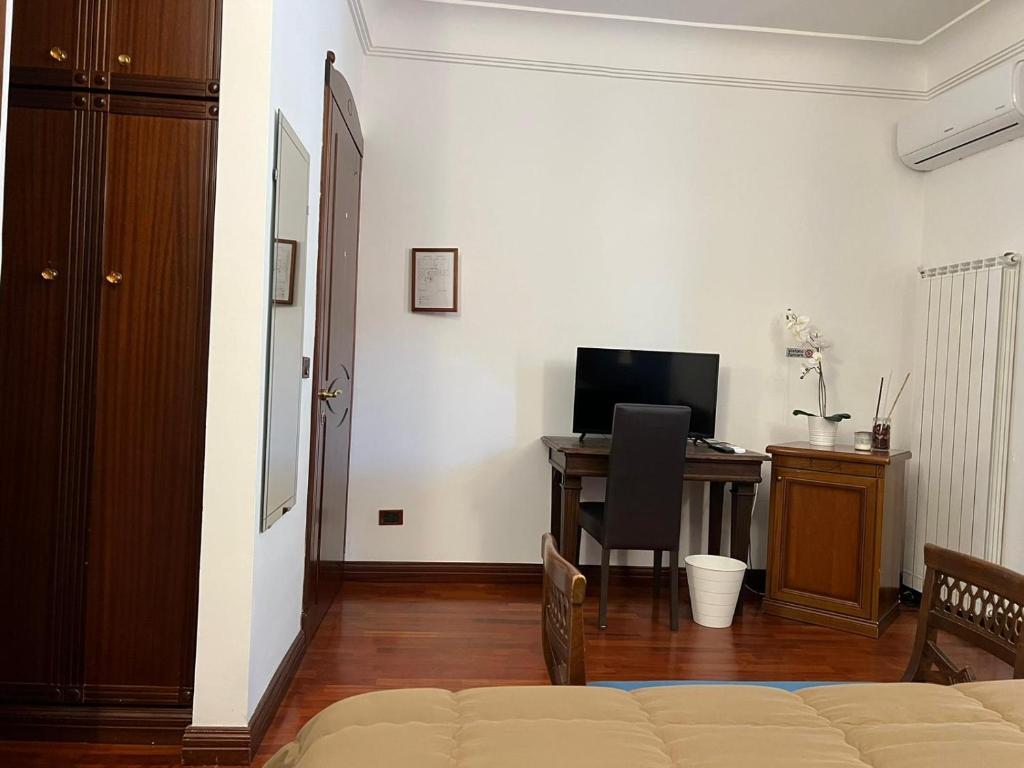 TV a/nebo společenská místnost v ubytování B&B IL CONTE