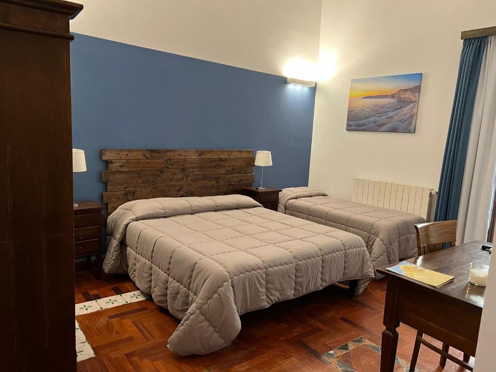 Postel nebo postele na pokoji v ubytování B&B IL CONTE