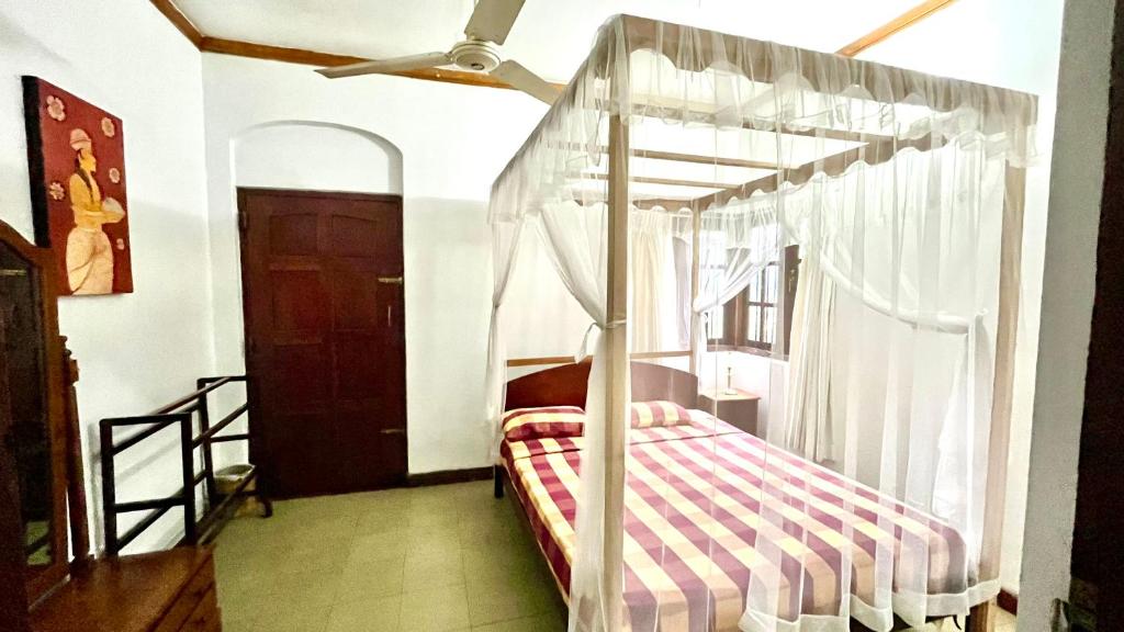 Postel nebo postele na pokoji v ubytování Pearl House