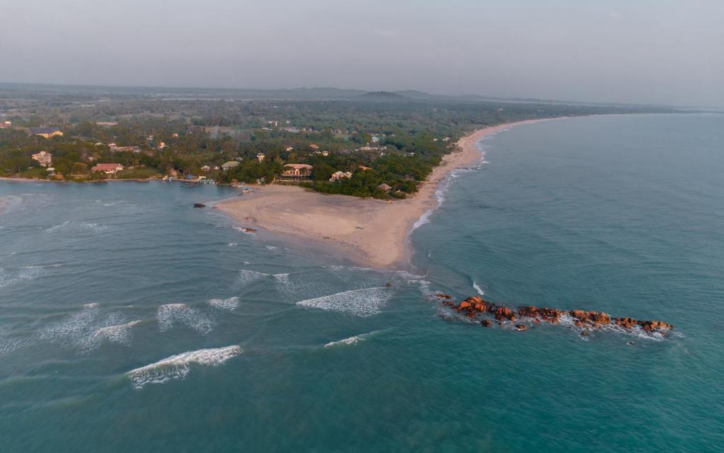 an aerial view of an island in the ocean at C Beyond Nilaveli in Nilaveli