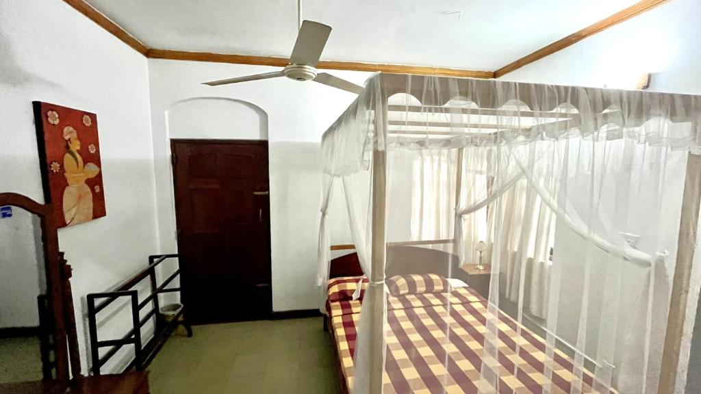 Postel nebo postele na pokoji v ubytování Pearl House