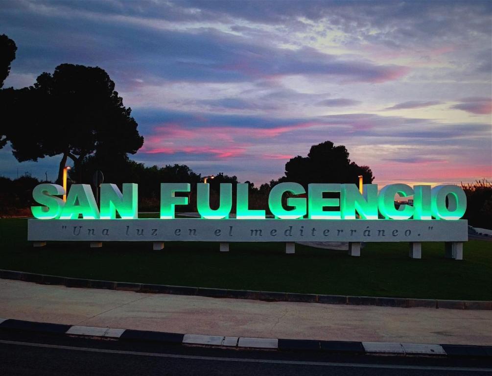a sign for san fernando hospital at sunset at Villa Marion in San Fulgencio
