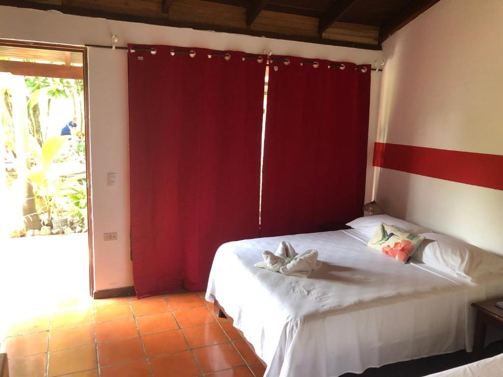 Postel nebo postele na pokoji v ubytování Hotel Hibiscus