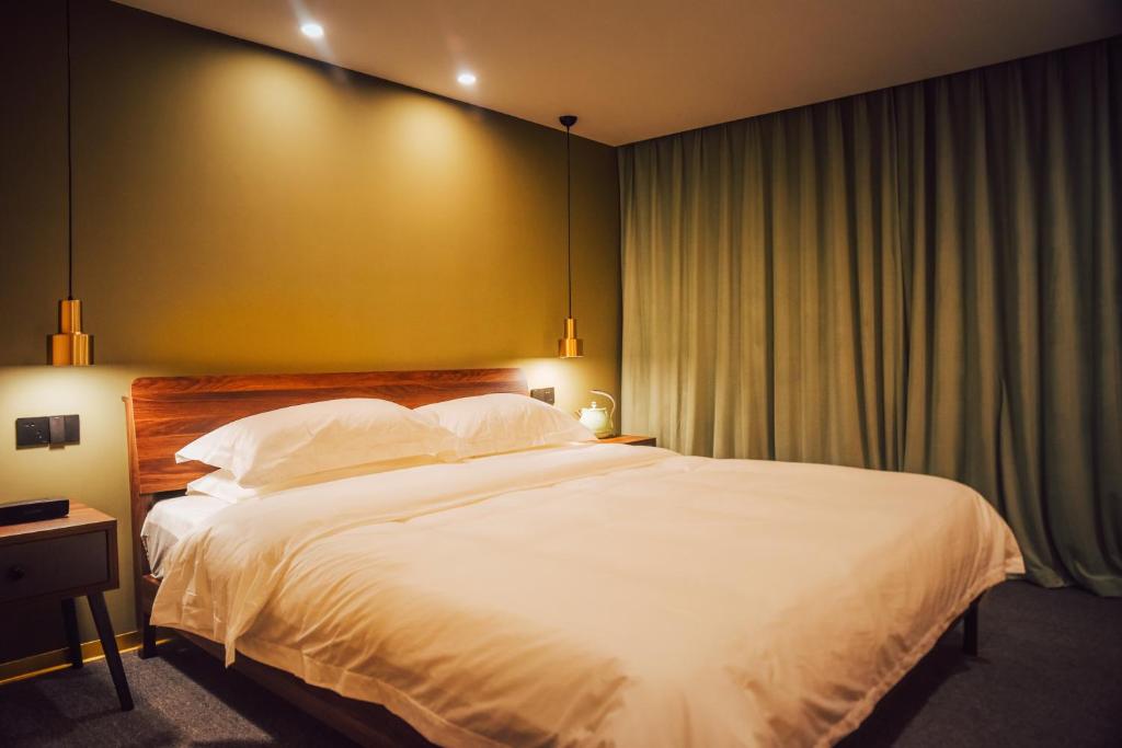 Postel nebo postele na pokoji v ubytování Lost In Beauty Guest House 龙脊梯田野望民宿