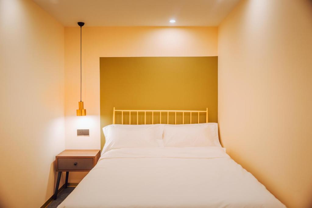 Postel nebo postele na pokoji v ubytování Lost In Beauty Guest House 龙脊梯田野望民宿