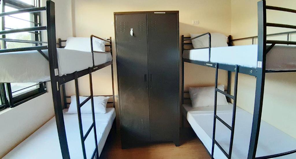 Postel nebo postele na pokoji v ubytování Monchere Dormitory