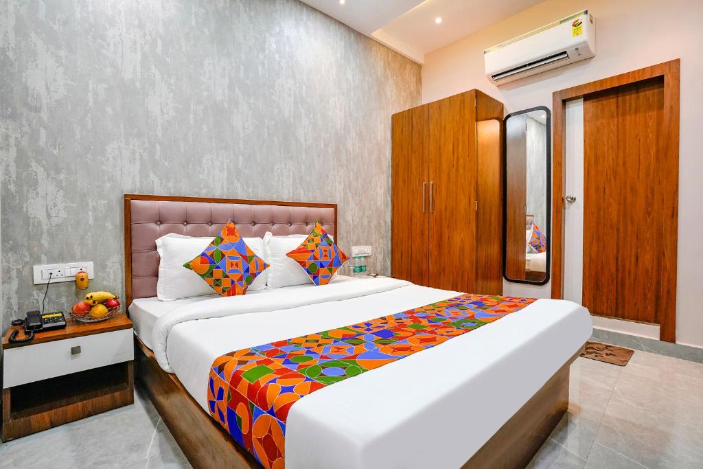 a bedroom with a large bed in a room at FabExpress Affari in Mumbai