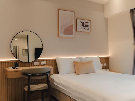 Postel nebo postele na pokoji v ubytování 參穗 SunSui B&B