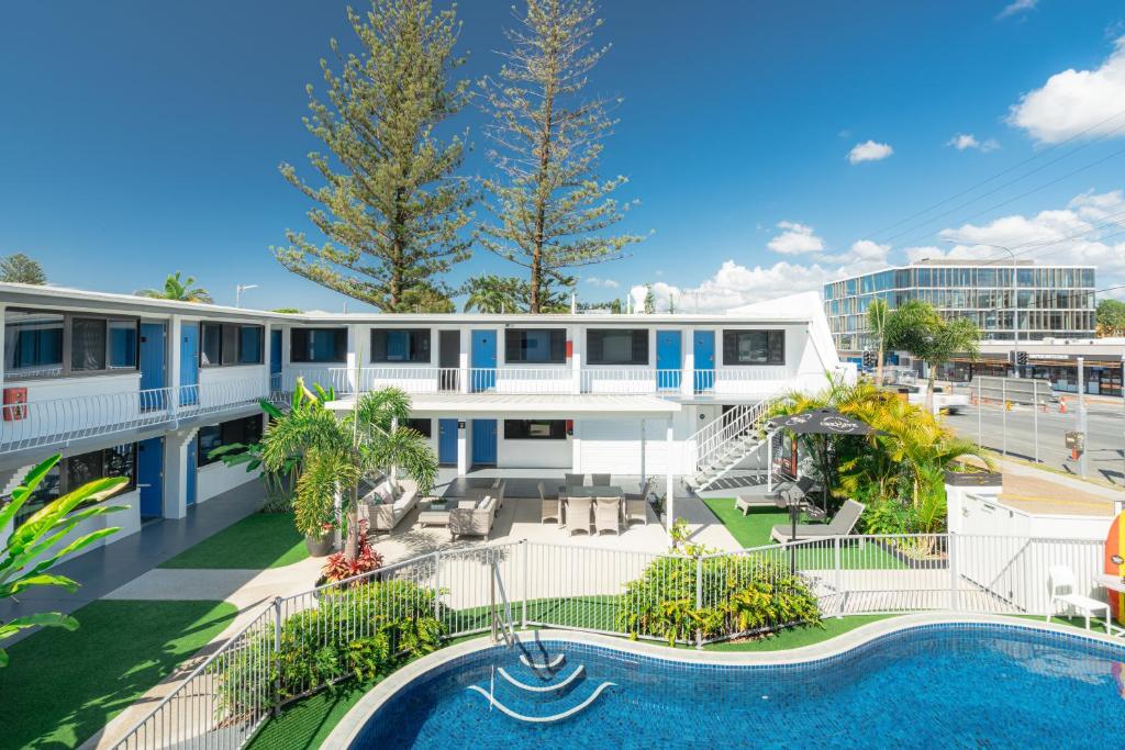 an aerial view of a building with a swimming pool at Montego Mermaid Beach Motel in Gold Coast