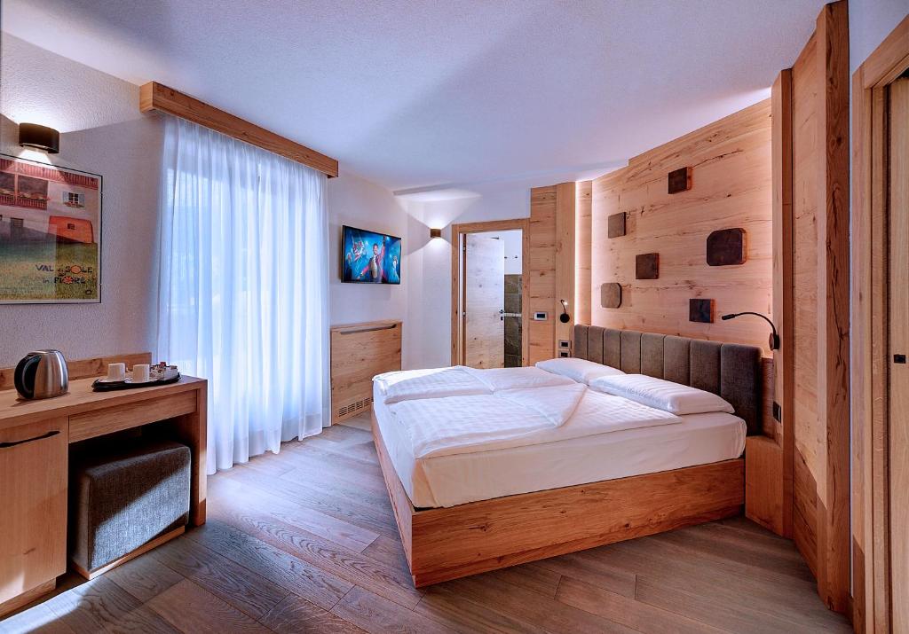 Postel nebo postele na pokoji v ubytování Hotel Madonna delle Nevi