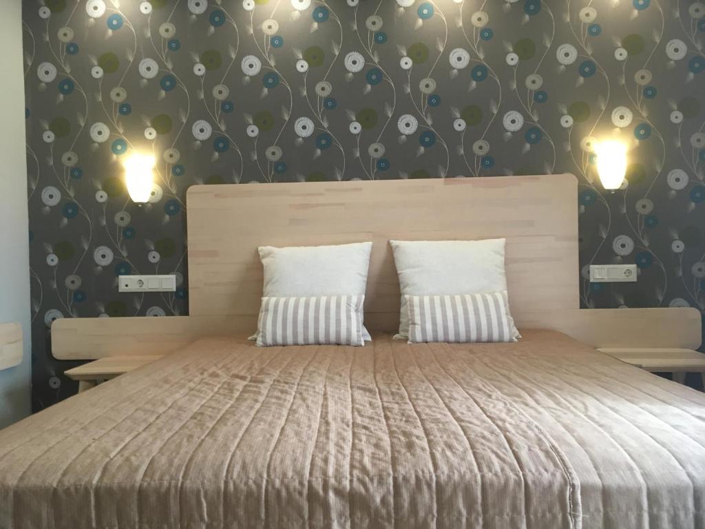 Postel nebo postele na pokoji v ubytování Kalives Resort
