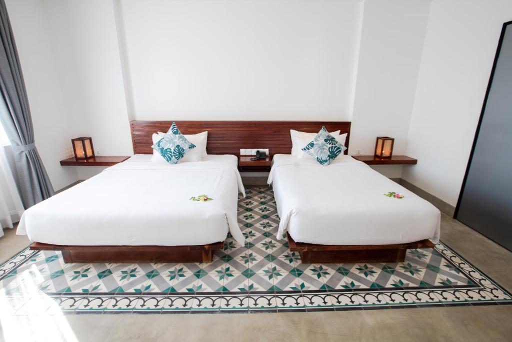Postel nebo postele na pokoji v ubytování DACO Hotel