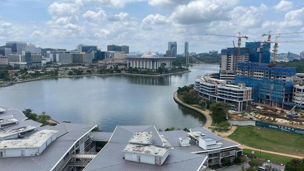 a view of a river with buildings and a city at VVIP LUXURIOUS HOMESTAY PUTRAJAYA FREE WIFI AND PARKING in Putrajaya