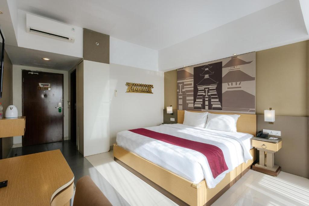 Postel nebo postele na pokoji v ubytování Horison Ultima Seminyak Bali - CHSE Certified
