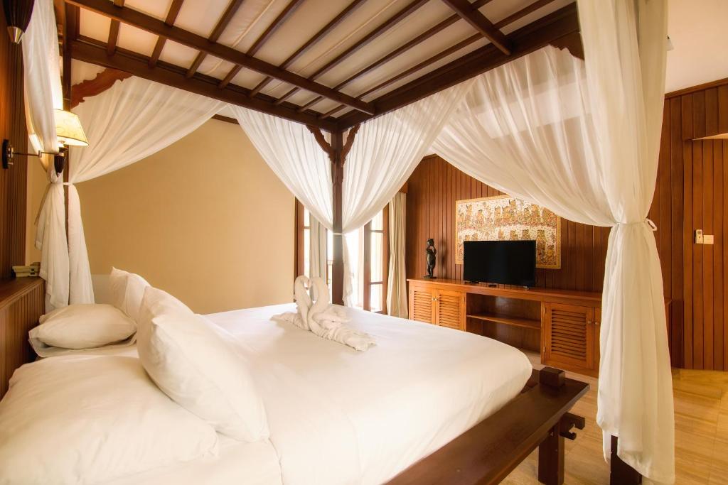 Postel nebo postele na pokoji v ubytování Champlung Sari Villa & Spa Ubud