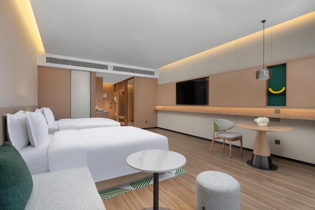 Postel nebo postele na pokoji v ubytování Holiday Inn Quanzhou Donghai by IHG