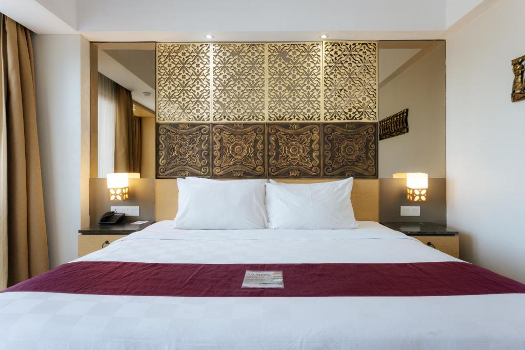 Postel nebo postele na pokoji v ubytování Horison Ultima Seminyak Bali - CHSE Certified