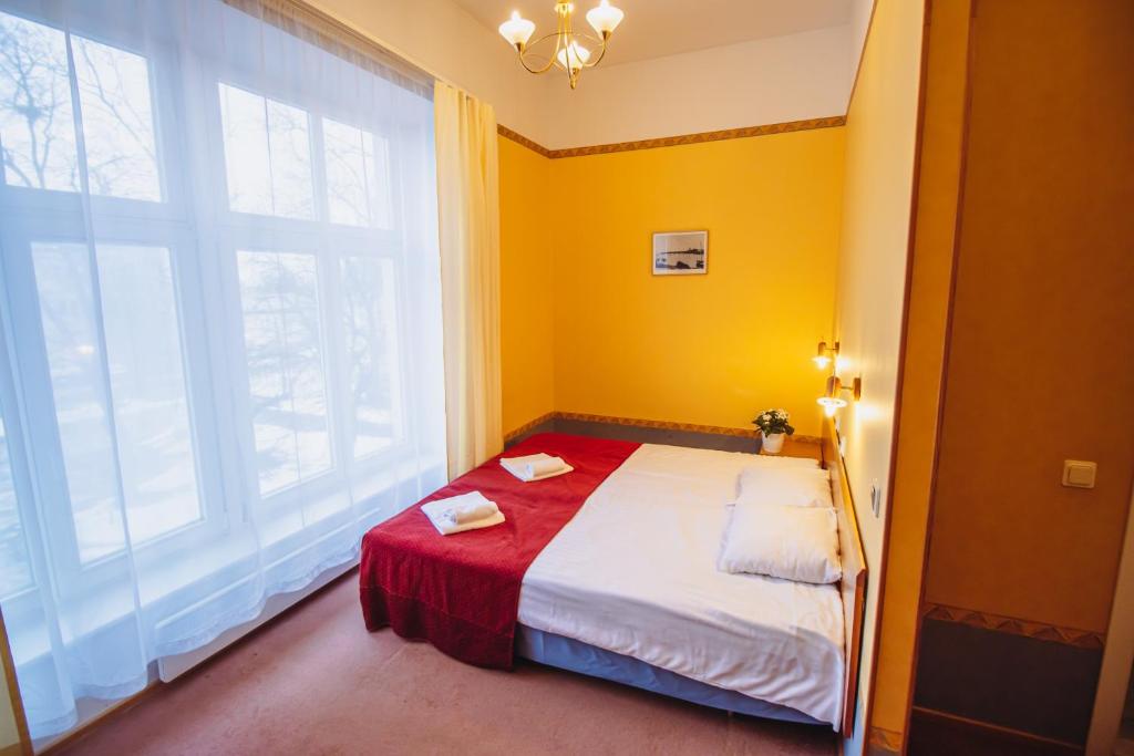 Postel nebo postele na pokoji v ubytování Hotel Promenaadi
