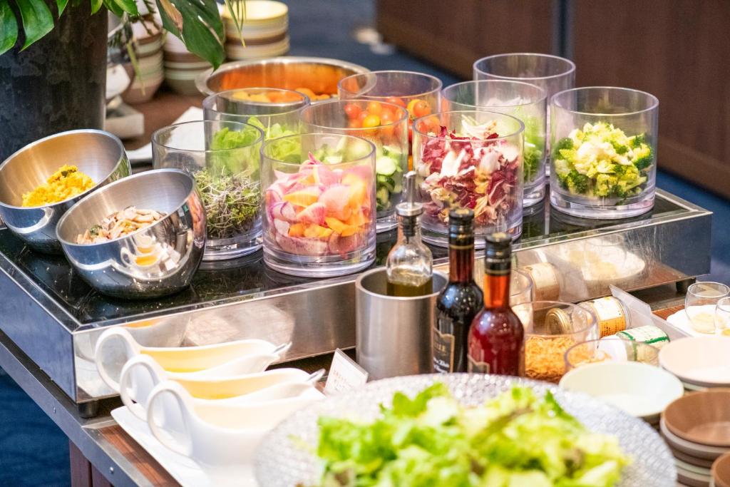 a buffet with many dishes of food and bottles of wine at Shibuya Excel Hotel Tokyu in Tokyo