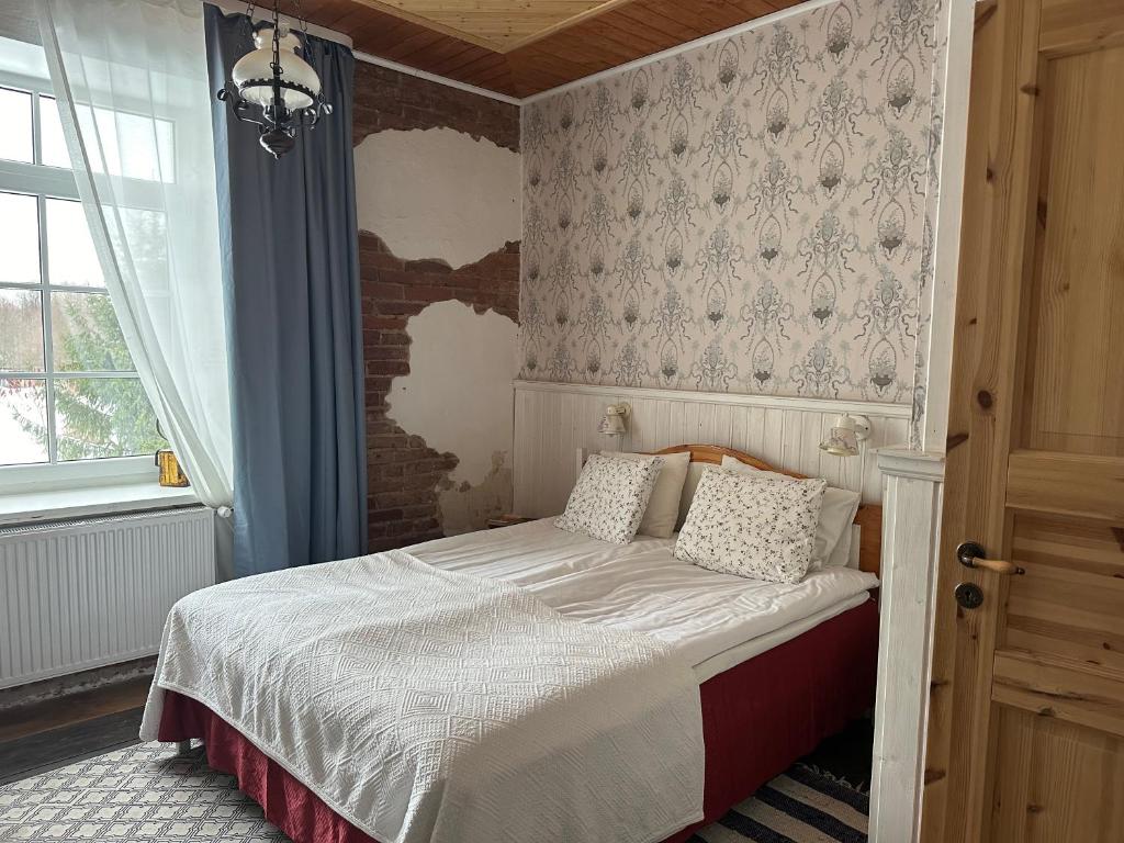 Voodi või voodid majutusasutuse Guesthouse Kadrina Mõis toas