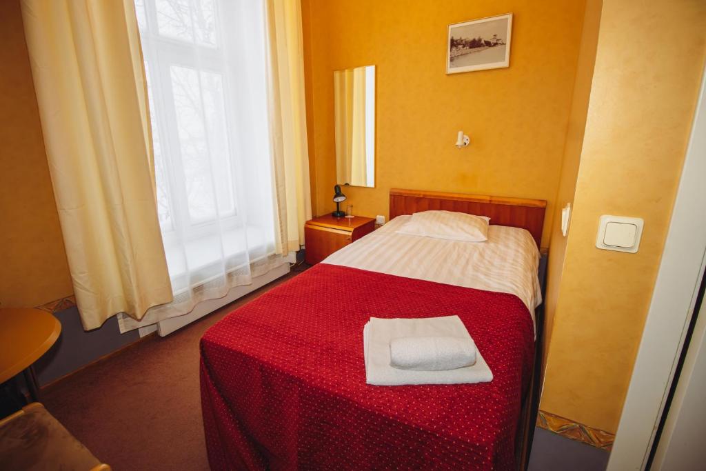Postel nebo postele na pokoji v ubytování Hotel Promenaadi
