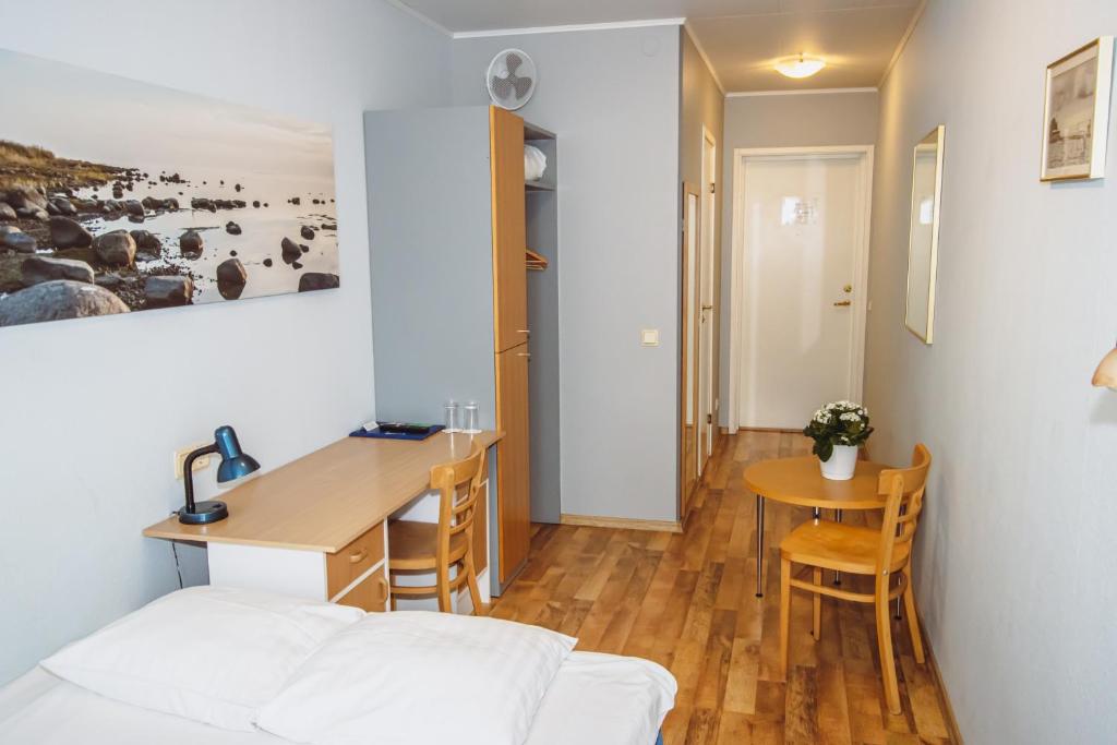 Postel nebo postele na pokoji v ubytování Hotel Promenaadi