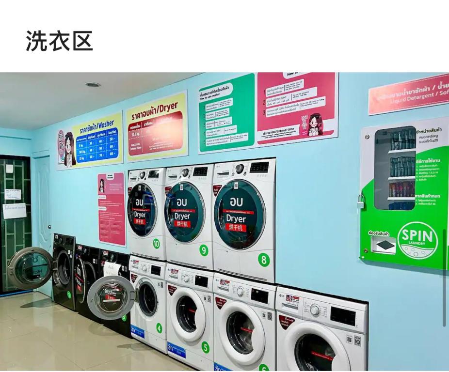 a row of washers and dryers in a store at Ningman Road Apartment in Chiang Mai