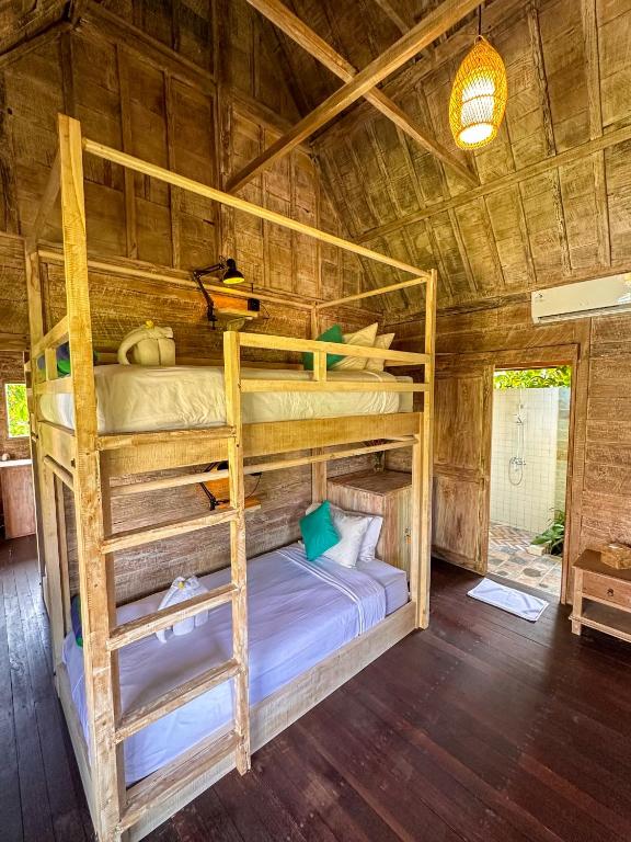 Postel nebo postele na pokoji v ubytování Nunu Bali Eco Friendly Retreat