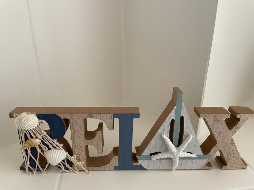 a sign for a museum with a ball and a net at Ferienwohnung kleine Strandperle in Norderney