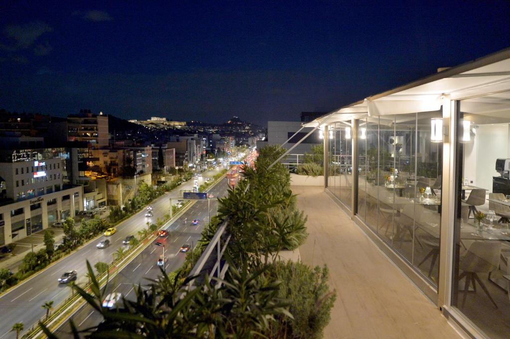 a view of a city street at night at Athenaeum Smart Hotel in Athens