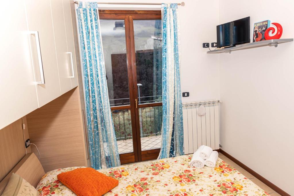 Posteľ alebo postele v izbe v ubytovaní Residenza Coccinelle vista Lago d'Iseo
