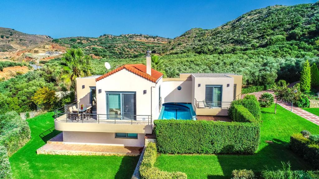 an aerial view of a house with a green yard at Anemon Villas in Kissamos
