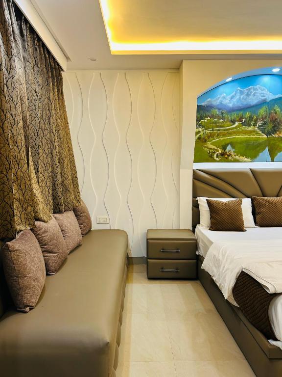 a bedroom with a bed and a painting on the wall at The Starfish Studio , Mussoorie road in Dehradun