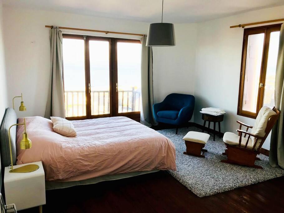 Postel nebo postele na pokoji v ubytování L'Eglantine bord de mer