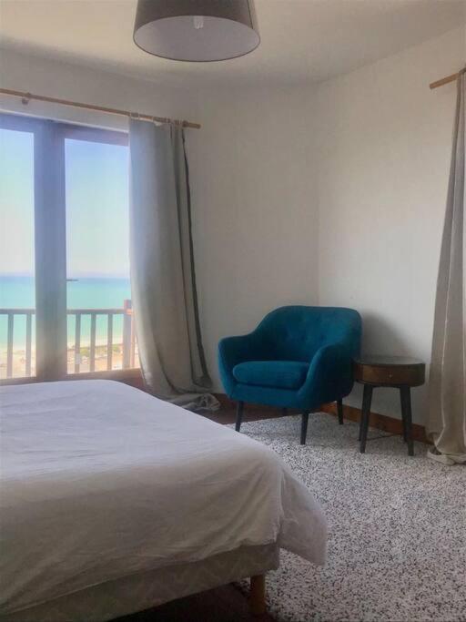 Postel nebo postele na pokoji v ubytování L'Eglantine bord de mer