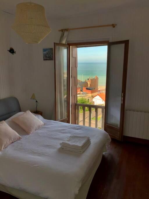 Postel nebo postele na pokoji v ubytování L'Eglantine bord de mer