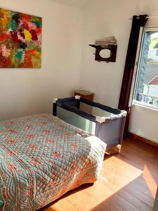 Postel nebo postele na pokoji v ubytování L'Eglantine bord de mer