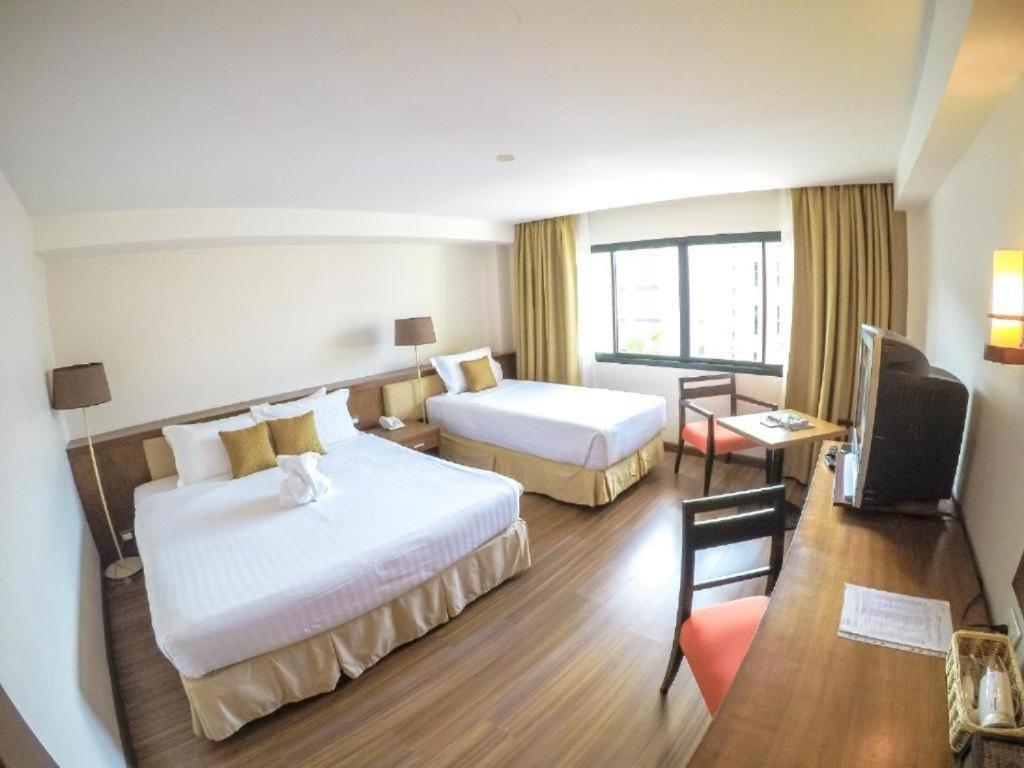 Postel nebo postele na pokoji v ubytování Hiran Residence