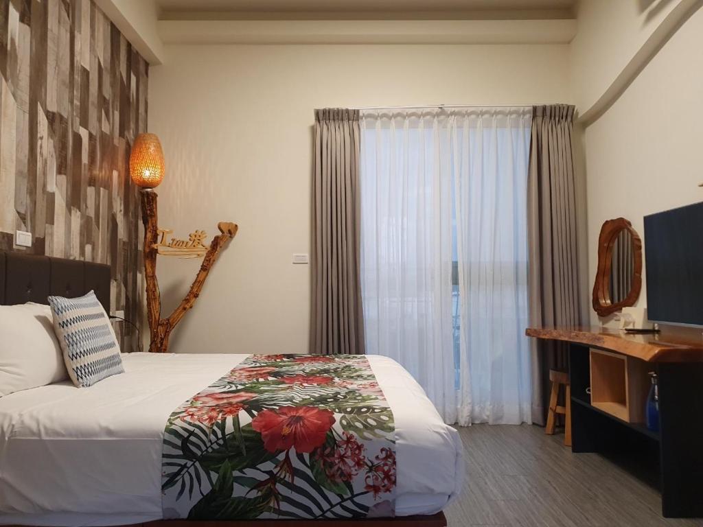 Postel nebo postele na pokoji v ubytování Inn巷文創旅店 Inn siang B&B-墾丁夢幻島
