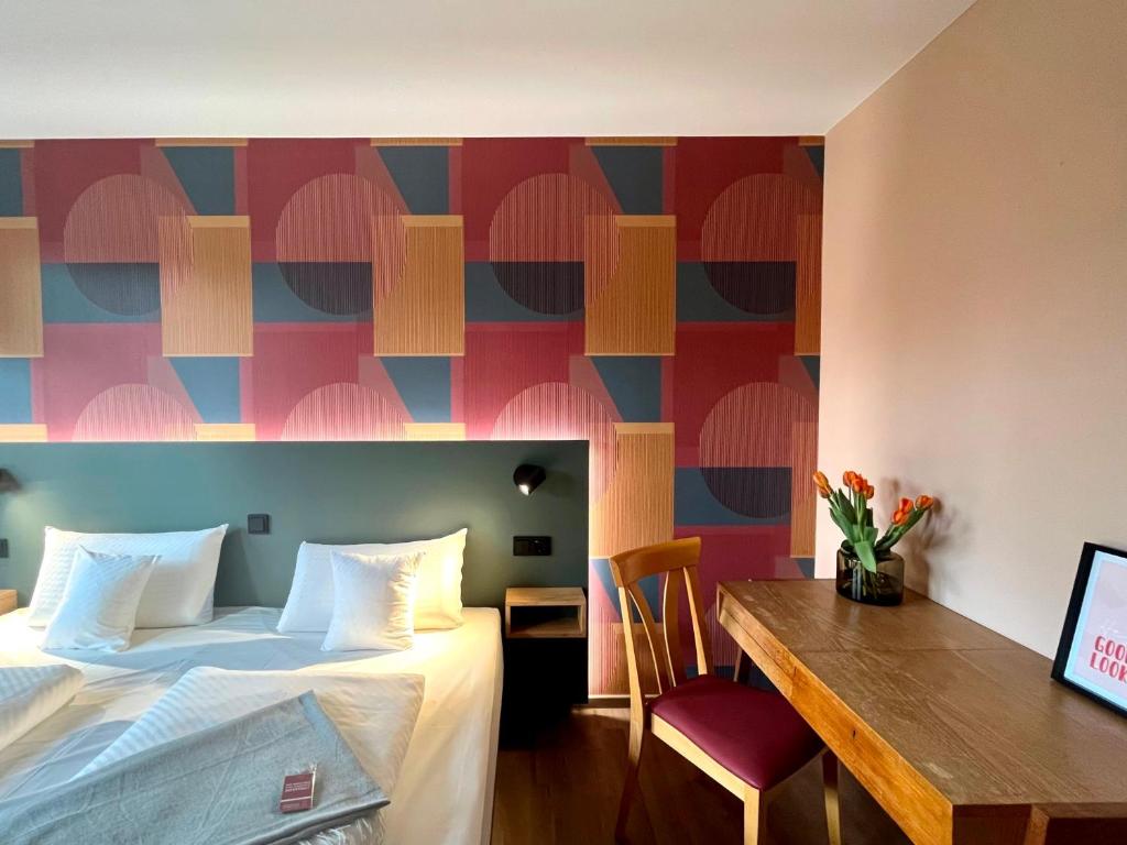 Postel nebo postele na pokoji v ubytování Kloster-Quartier