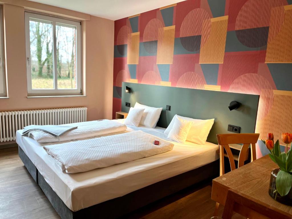 Postel nebo postele na pokoji v ubytování Kloster-Quartier