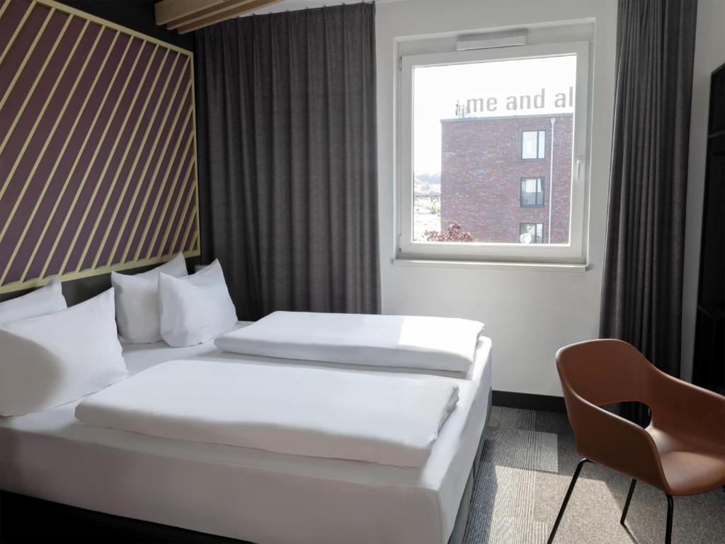Postel nebo postele na pokoji v ubytování B&B Hotel Kiel-City